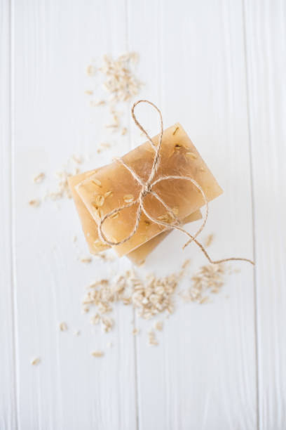istock White and beige handmade soap bars with oat flakes 954157238