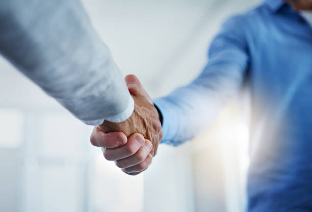 istock Partnering up to improve their business performance 954160178