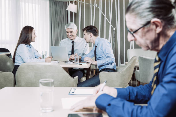 istock Business Team and Senior Man Working in Cafe 954161980