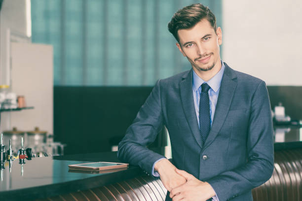 istock Friendly Middle-aged Businessman at Cafe Counter 954162098