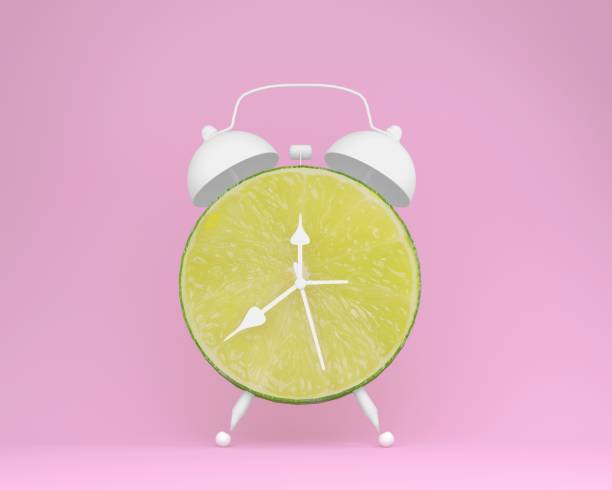 istock Creative idea layout fresh lime slice alarm clock on pastel pink background. minimal idea business concept. fruit idea creative to produce work within an advertising marketing communications 954164524
