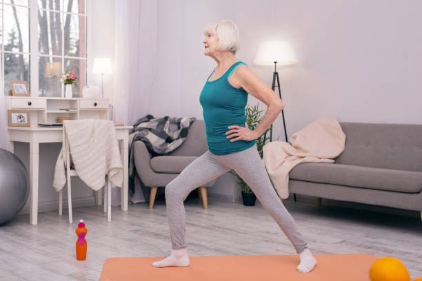 istock Pleasant senior woman doing lunges in the morning 954164816