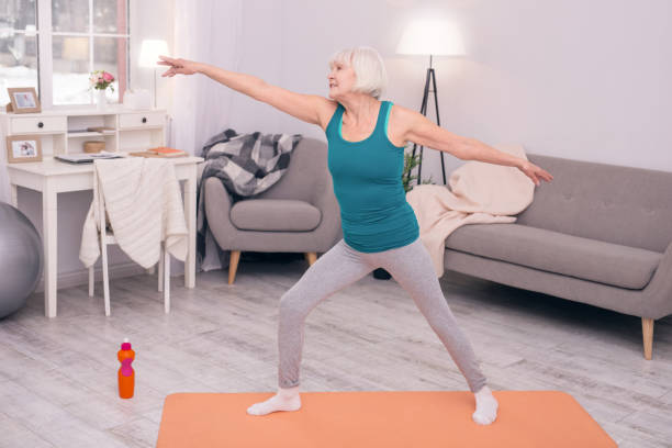 istock Cheerful elderly woman exercising in the morning 954165082