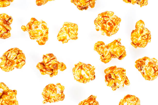 Pieces of caramel popcorn isolated on white background