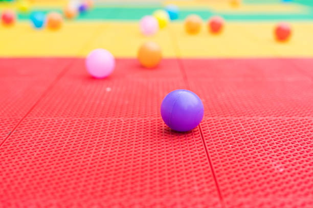 Colored plastic balls on white background