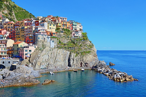 Manarola, Italy - May 16th, 2017: view of Manarola, one of five famous centuries-old colorful villages of Cinque Terre National Park in Liguria, region of Italy.
