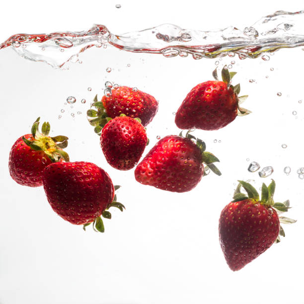 istock Fresh strawberries are dropped into water. 954172048