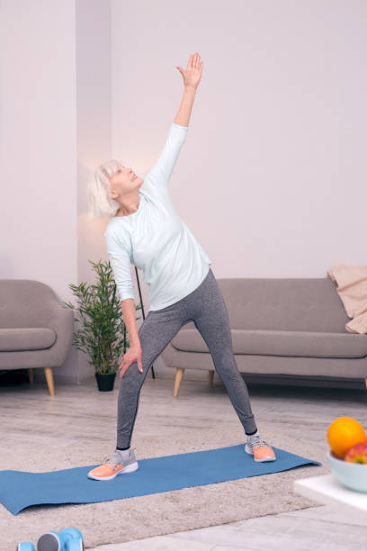 istock Upbeat senior woman standing in gate pose 954172224