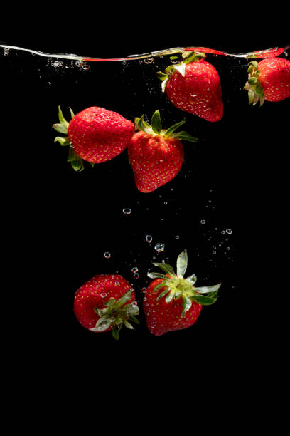 istock Fresh strawberries are dropped into water. 954172286