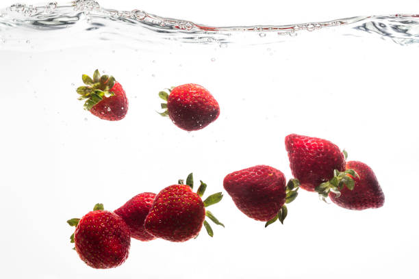 istock Fresh strawberries are dropped into water. 954172632