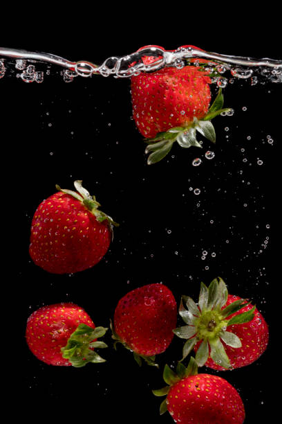 istock Fresh strawberries are dropped into water. 954172704