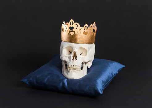 King skull wearing a gold crown