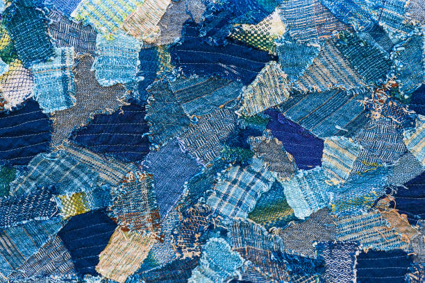 Denim jeans background. Ripped denim patch on destroyed torn denim blue jeans. Double color denim jeans fashion background. patchwork stock pictures, royalty-free photos & images