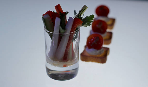 istock Set of mixed appetizers and snacks on the illuminated shelf 954182540