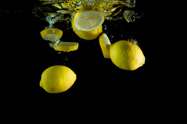 istock Fresh lemons are dropped into water. 954187542
