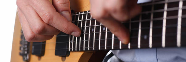 istock Male arms playing classic shape electric guitar 954191594