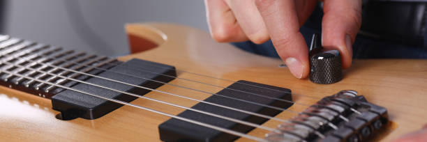 istock Male arms playing classic shape electric guitar 954191658