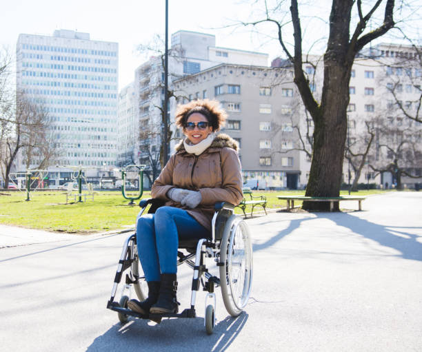 istock Disabled woman in a wheelchair looking at camera 954197020