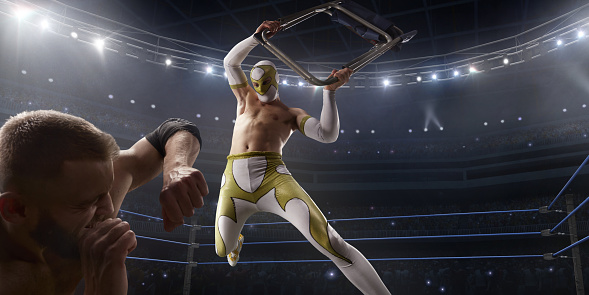 Lucha libre de espectáculo. Dos luchadores en una ropa deportiva brillante y máscara lucha en el ring photo