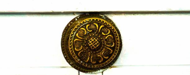 istock close up on a round door handle with decorative elements, door decoration 954207288