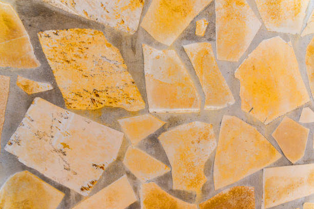 old stone placed in the wall, interesting and original background, solid wall