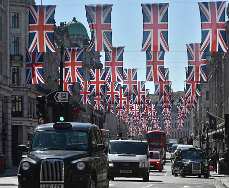 Regent Street in central London with Union Jack British flags at the time of a Royal celebration
