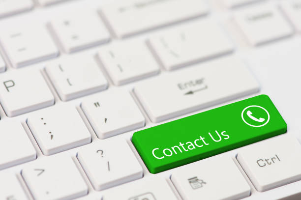 istock green key with text Contact us and open phone icon on white laptop keyboard 954221018
