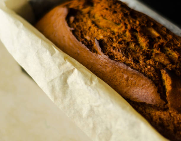 Freshly baked banana cake with nuts, banana bread in baking form