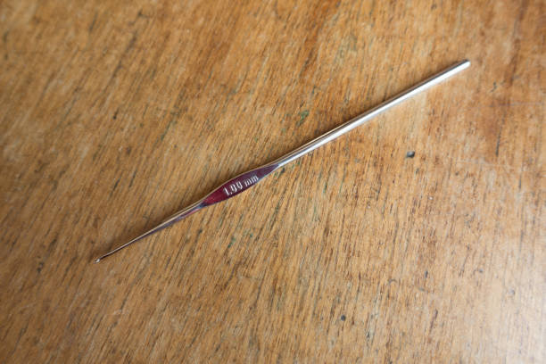 istock One 1 mm steel crochet hook on wood 954229154