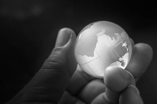 istock Globe is made of glass on hand in dark background 954229892