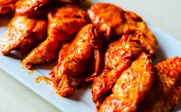 istock chicken wings marinated in a barbecue sauce, a typical American snack 954229942