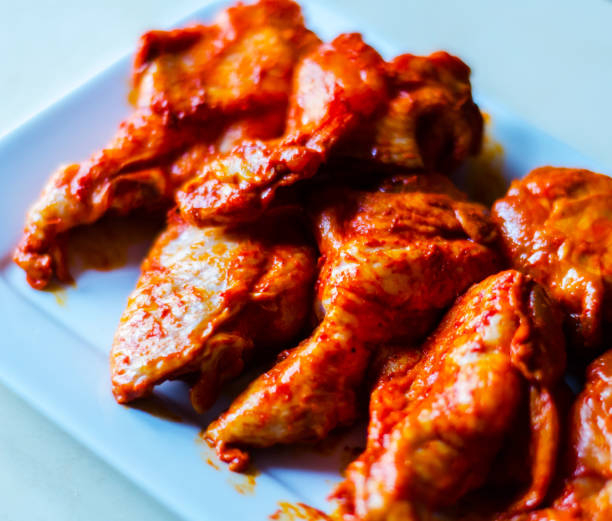 istock chicken wings marinated in a barbecue sauce, a typical American snack 954229970
