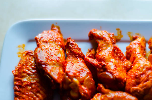 istock chicken wings marinated in a barbecue sauce, a typical American snack 954230020