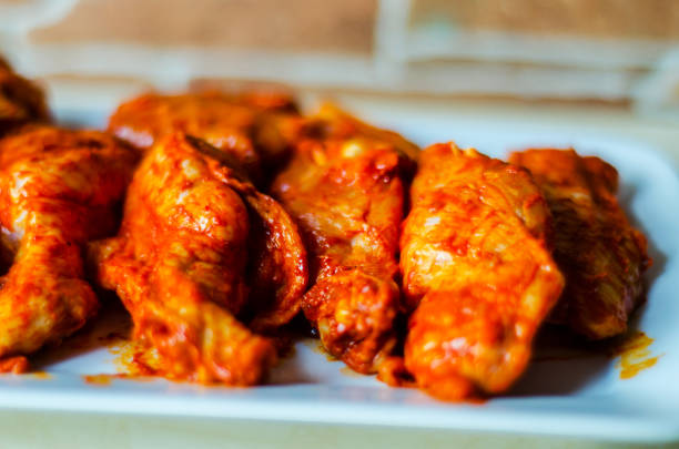 istock chicken wings marinated in a barbecue sauce, a typical American snack 954230144