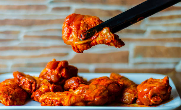 istock chicken wings marinated in a barbecue sauce, a typical American snack 954230188