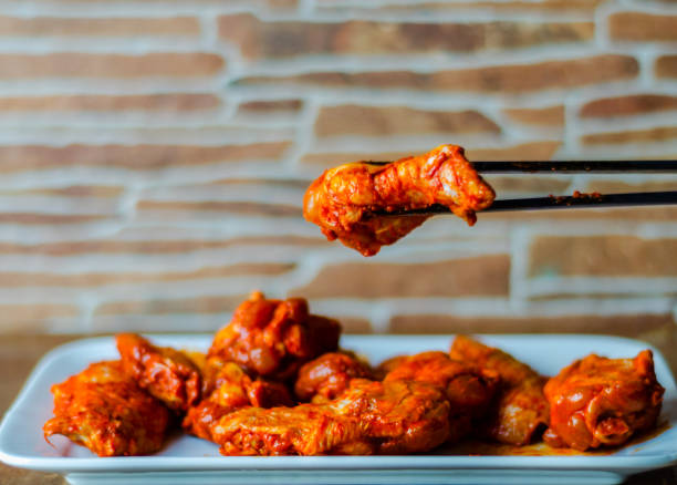 istock chicken wings marinated in a barbecue sauce, a typical American snack 954230192
