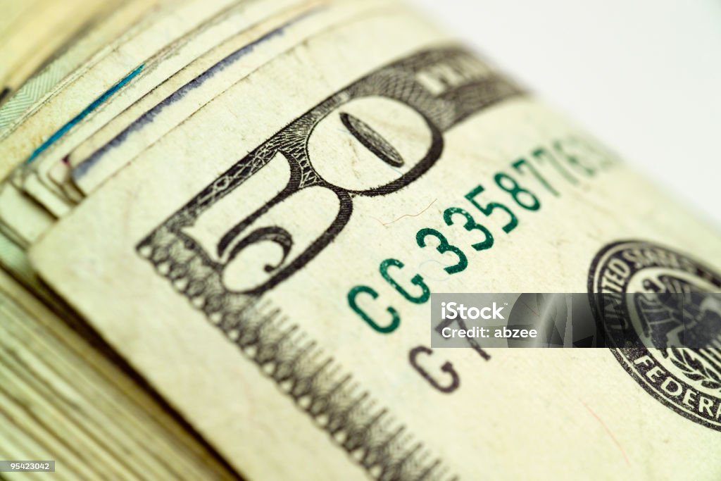 Roll of fifties Roll of fifties. American Fifty Dollar Bill Stock Photo