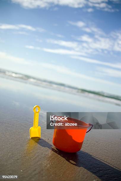 Childs Bucket At An Angle Stock Photo - Download Image Now - Beach, Blue, Bucket