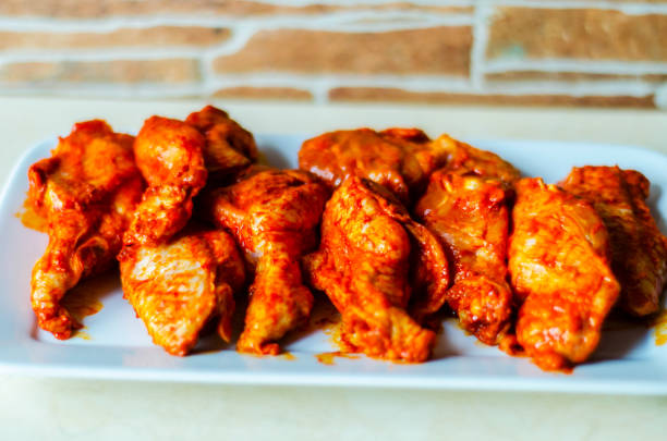 istock chicken wings marinated in a barbecue sauce, a typical American snack 954234984