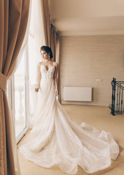 istock beautiful bride in luxurious wedding dress 954235672