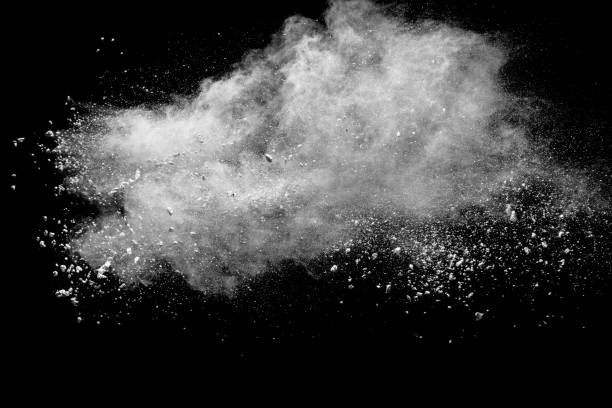 istock Launched white powder splash on black background. Bizarre forms of of white powder explosion cloud against dark background. 954235918