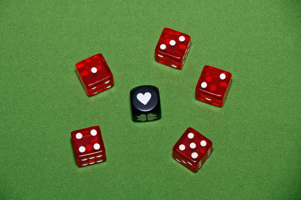 istock Dices on a green velvet table. 954239922
