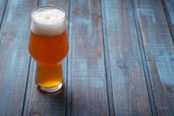 istock Pale ale on blue wood 954240386