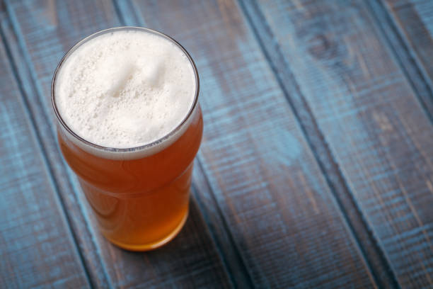 istock Pale ale on blue wood 954240482