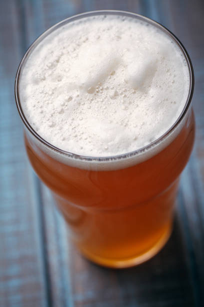 istock Pale ale on blue wood 954240514