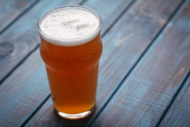 istock Pale ale on blue wood 954240526