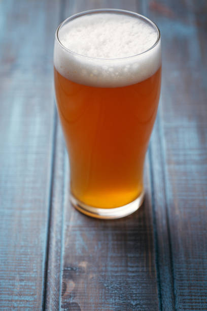 istock Pale ale on blue wood 954240580