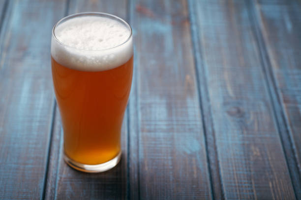 istock Pale ale on blue wood 954240588