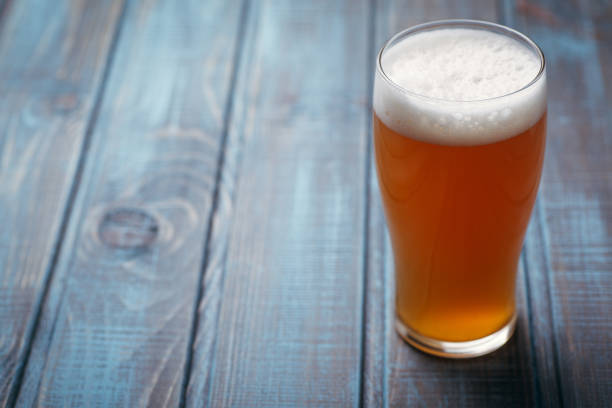 istock Pale ale on blue wood 954240596