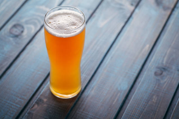 istock Pale ale on blue wood 954240702